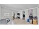 Living room with tile floors, an air conditioner, and a flat screen TV at 1019 Milner E Dr, Lakeland, FL 33810