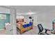 Bedroom with wood-look flooring and door leading to bathroom at 1019 Milner E Dr, Lakeland, FL 33810