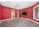 Spacious bedroom with gray carpet, ceiling fan, and natural light from multiple windows at 105 Woden Way, Winter Haven, FL 33884
