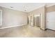 Spacious bedroom with a ceiling fan, tiled flooring, and walk-in closet at 105 Woden Way, Winter Haven, FL 33884