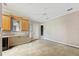 Bonus room featuring kitchenette, ceiling fan, tiled floor, and natural light at 105 Woden Way, Winter Haven, FL 33884