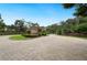 Inviting community entrance with a guardhouse and beautifully landscaped surroundings at 105 Woden Way, Winter Haven, FL 33884