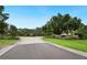 Welcoming community entrance with brick signage and landscaping, creating an inviting atmosphere at 105 Woden Way, Winter Haven, FL 33884