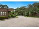 Gated community entrance featuring well-maintained landscaping and a secure entry point at 105 Woden Way, Winter Haven, FL 33884