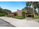 Inviting home with unique architectural details, beautiful landscaping, and a convenient carport at 105 Woden Way, Winter Haven, FL 33884