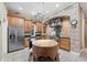 Kitchen features stainless steel appliances, custom cabinets, and a stone backsplash at 105 Woden Way, Winter Haven, FL 33884