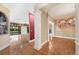 Open concept living and dining room featuring wood floors, neutral paint, and columns at 105 Woden Way, Winter Haven, FL 33884