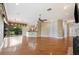 Spacious living room with hardwood floors, stone fireplace, and built-in shelving at 105 Woden Way, Winter Haven, FL 33884