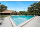 Large community pool with plenty of space for recreation and relaxation on a sunny day at 105 Woden Way, Winter Haven, FL 33884
