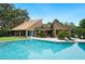 Enjoy the expansive community pool with serene views and plenty of space to unwind at 105 Woden Way, Winter Haven, FL 33884