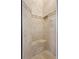 Shower featuring travertine-style tile with a built-in bench at 105 Woden Way, Winter Haven, FL 33884