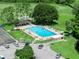 Aerial view of the sparkling community pool and surrounding recreational amenities at 1102 Eagle Pond Dr # 1102, Winter Haven, FL 33884