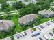 Aerial shot of property featuring manicured lawns and tropical landscaping at 1102 Eagle Pond Dr # 1102, Winter Haven, FL 33884