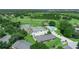 Aerial view showcasing the community's tennis courts, pool, and lush green surroundings at 1102 Eagle Pond Dr # 1102, Winter Haven, FL 33884