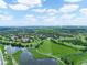 Scenic aerial of the lush community, showcasing lakes, golf course and neighborhood at 1102 Eagle Pond Dr # 1102, Winter Haven, FL 33884