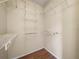 Spacious walk-in closet with shelves, offering plenty of room for clothing and accessories at 1102 Eagle Pond Dr # 1102, Winter Haven, FL 33884