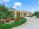 Attractive exterior of the community clubhouse featuring manicured landscaping and a circular driveway at 1102 Eagle Pond Dr # 1102, Winter Haven, FL 33884