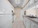 Bright kitchen with white appliances and tile flooring at 1102 Eagle Pond Dr # 1102, Winter Haven, FL 33884