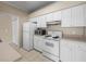 Practical kitchen with essential appliances and storage space at 1102 Eagle Pond Dr # 1102, Winter Haven, FL 33884