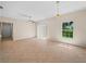 Bright living room with tile flooring, ceiling fan, light fixture, window and sliding doors at 1102 Eagle Pond Dr # 1102, Winter Haven, FL 33884