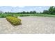 Expansive paver parking area with beautiful green space and an overview of the golf course at 1102 Eagle Pond Dr # 1102, Winter Haven, FL 33884