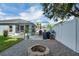 Large backyard with a patio, fire pit, and great space for entertaining at 124 Eagle Point Blvd, Auburndale, FL 33823
