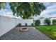 Landscaped backyard with a fire pit and plenty of space for outdoor activities at 124 Eagle Point Blvd, Auburndale, FL 33823