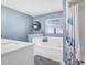 Bright bathroom with garden tub, separate shower, and modern fixtures at 124 Eagle Point Blvd, Auburndale, FL 33823