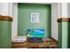 Bedroom showcasing a built-in desk with ocean view wallpaper and ample workspace at 124 Eagle Point Blvd, Auburndale, FL 33823