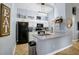 Charming kitchen with granite countertops, stainless steel sink and modern lighting at 124 Eagle Point Blvd, Auburndale, FL 33823