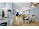 Open-concept living space showing the kitchen, dining area and living room, all with matching tile flooring at 124 Eagle Point Blvd, Auburndale, FL 33823