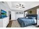 Spacious main bedroom with accent wall, ceiling fan, and ensuite bathroom at 124 Eagle Point Blvd, Auburndale, FL 33823