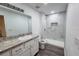 Renovated bathroom with granite countertops, tiled shower, and new fixtures at 1476 Avenue F Ne, Winter Haven, FL 33881