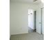 Bright bedroom features neutral carpeting, white walls and trim and closet at 1476 Avenue F Ne, Winter Haven, FL 33881