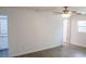 Bedroom featuring wood flooring, neutral paint, a ceiling fan, and access to a bathroom at 1476 Avenue F Ne, Winter Haven, FL 33881