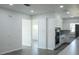 Open-concept kitchen featuring modern appliances, white cabinetry, and stylish countertops at 1476 Avenue F Ne, Winter Haven, FL 33881