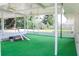 Spacious screened in patio overlooking the backyard and lush greenery at 1476 Avenue F Ne, Winter Haven, FL 33881