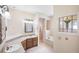 Comfortable bathroom with a soaker tub, glass shower, and dual sinks at 15 Edwards Shrs, Haines City, FL 33844