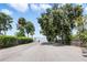 Community boat ramp nestled among trees, offering easy access to the serene lake for boating and recreation at 15 Edwards Shrs, Haines City, FL 33844