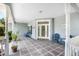 Inviting covered front porch with chairs, offering a relaxing outdoor space at 15 Edwards Shrs, Haines City, FL 33844