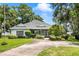 Inviting single-story home with a well-kept lawn and attractive landscaping at 15 Edwards Shrs, Haines City, FL 33844