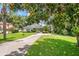 Quaint single-story home on a large lot featuring a spacious front yard and mature landscaping at 15 Edwards Shrs, Haines City, FL 33844