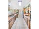 Bright kitchen features tile floors, stainless steel appliances, and plenty of counter space at 15 Edwards Shrs, Haines City, FL 33844