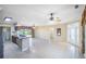 Spacious living area featuring tile flooring, natural light, and open access to kitchen at 15 Edwards Shrs, Haines City, FL 33844
