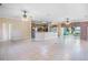 Open-concept living area with tile floors, ceiling fans, and access to the patio at 15 Edwards Shrs, Haines City, FL 33844