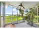 Screened porch offers picturesque views of the lake, perfect for relaxing and enjoying the outdoors at 15 Edwards Shrs, Haines City, FL 33844