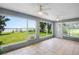 Sunroom featuring scenic views of the waterfront, creating a relaxing indoor-outdoor living experience at 15 Edwards Shrs, Haines City, FL 33844