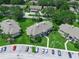 This is an aerial view of the condo community with greenery and parking at 1507 Eagle Pond Dr # 1507, Winter Haven, FL 33884