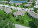 This is an aerial view of the community with landscaping, parking, and a pond at 1507 Eagle Pond Dr # 1507, Winter Haven, FL 33884