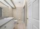 Bathroom featuring a shower, vanity, and tile flooring at 1507 Eagle Pond Dr # 1507, Winter Haven, FL 33884